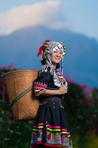 Woman wearing hat standing outdoors