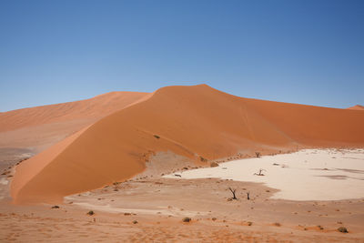 Scenic view of desert against clear sky