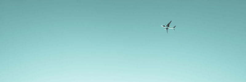 Panoramic view of airplane against clear sky