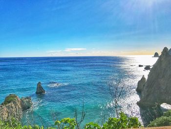 Scenic view of sea against clear blue sky