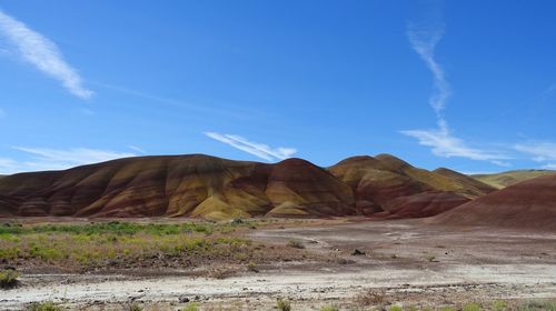 View of desert against cloudy sky