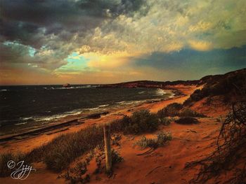 Scenic view of sea at sunset