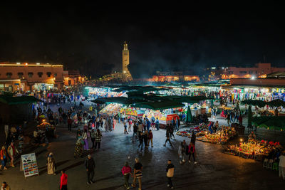 High angle view of illuminated buildings in city at night