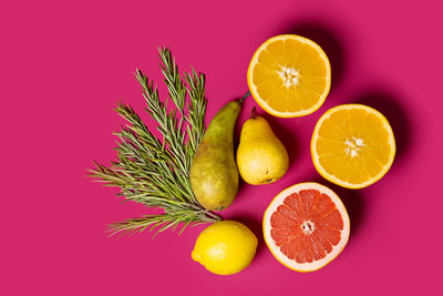 Close-up of oranges against orange background