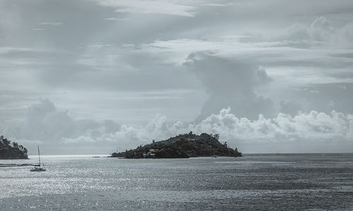 Scenic view of sea against storm clouds