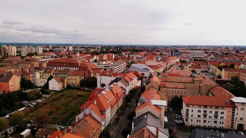 High angle view of townscape against cloudy sky