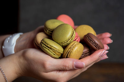 Close-up of hand holding cake