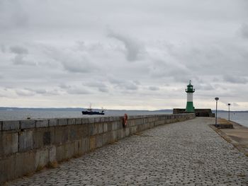 Scenic view of lighthouse by sea against sky