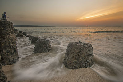 Scenic view of sea against sky during sunset