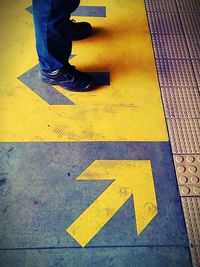 Low section of people walking on road