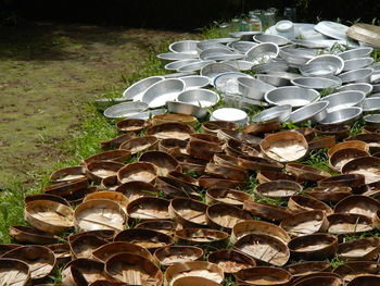 View of crockery laid out on grass