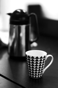 Close-up of coffee cup on table