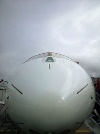 Low angle view of airplane against sky