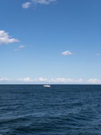 Scenic view of sea against blue sky