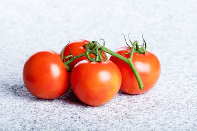 Close-up of tomatoes growing on table