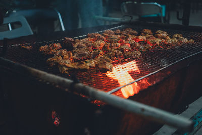 High angle view of meat on barbecue grill