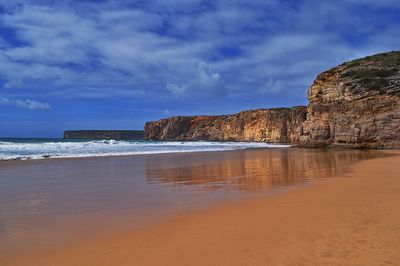 Scenic view of beach against sky