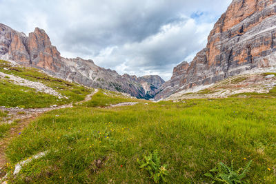 Scenic view of mountains against cloudy sky