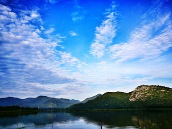 Scenic view of lake against blue sky