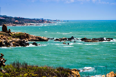 Scenic view of sea against clear blue sky