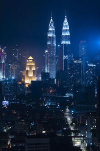 Illuminated buildings in city at night