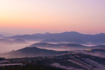 High angle view of landscape against romantic sky at sunset