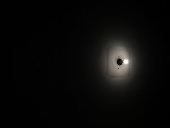 Illuminated lamp in dark room