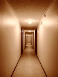 Illuminated corridor in hotel