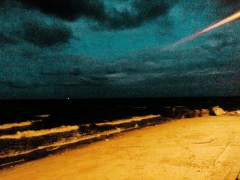 Scenic view of sea against sky at night
