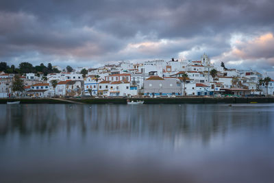 Ferragudo city beach landscape at sunrise in algarve, portugal