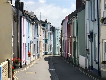 Street amidst buildings in city against sky