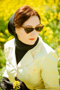 Portrait of young woman wearing sunglasses