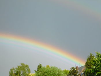 Low angle view of rainbow against sky