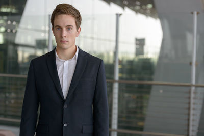 Portrait of young man standing outdoors