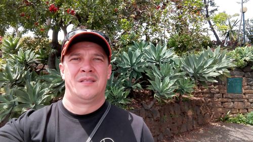 Portrait of man against plants