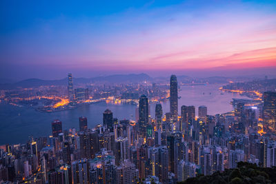 High angle view of city lit up at night