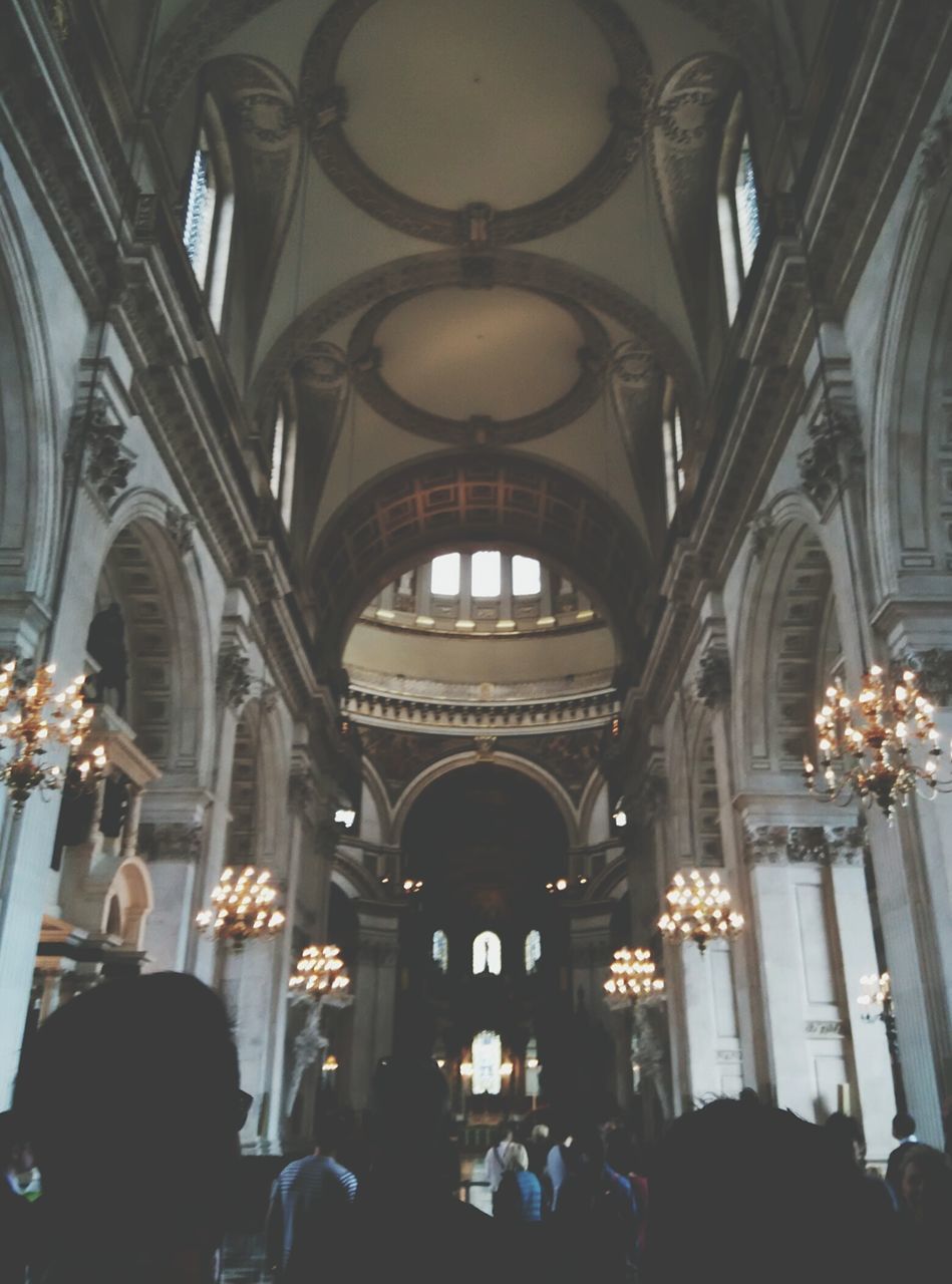 indoors, place of worship, religion, arch, spirituality, church, architecture, ceiling, built structure, cathedral, interior, low angle view, famous place, person, tourism, architectural column, history