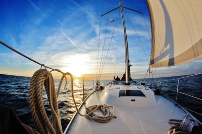 Boats sailing in sea against sky