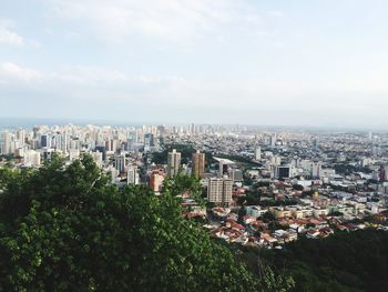 High angle view of buildings in city against sky