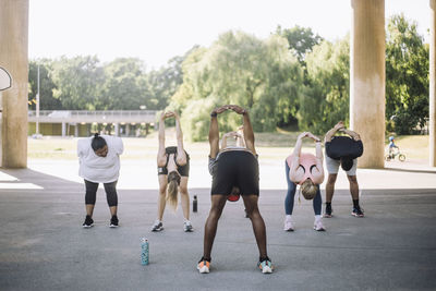 Instructor doing stretching with team during training session