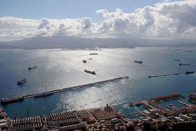High angle view of boats moored on sea against sky