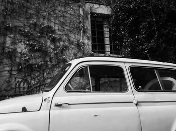 View of building through car window trastevere 