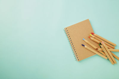 High angle view of books against blue background
