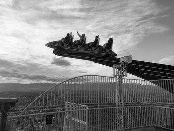 People enjoying x-scream thrill ride at stratosphere las vegas hotel against sky