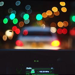 Defocused image of illuminated city at night