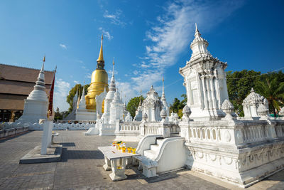 Statue in temple against sky