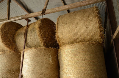 Straw bales stacked in a barn