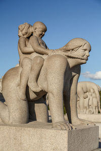 Low angle view of statue against sky