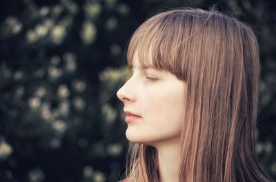 Close-up of teenage girl looking away