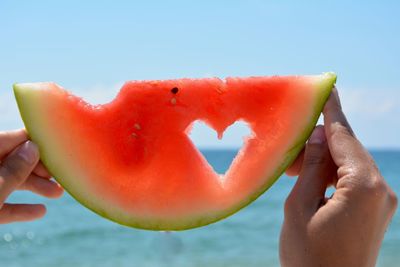 Close-up of hand holding watermelon 